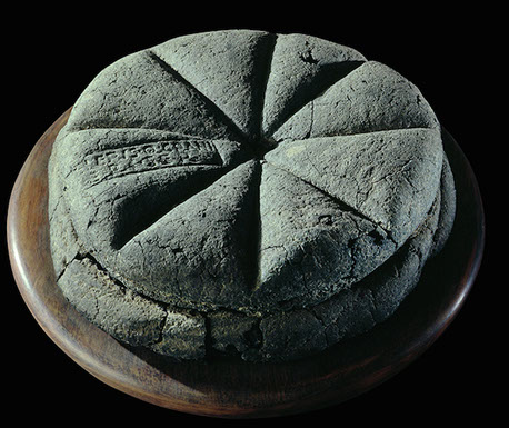 Fossilised bread found in the ruins of Pompeii, 79AD. Museo Archeologico Nazionale di Napolii (© Fotografica Foglia).